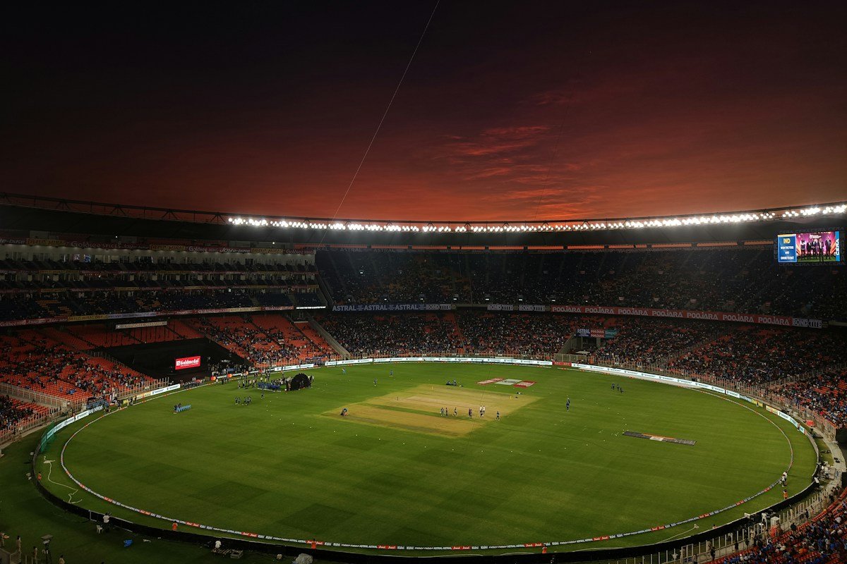 Cricket ground at dusk for online IPL match analysis